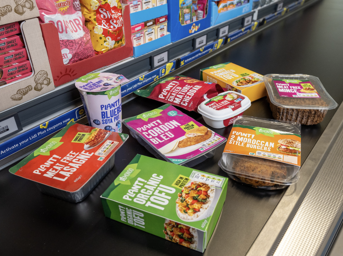 plant-based foods on grocery checkout belt